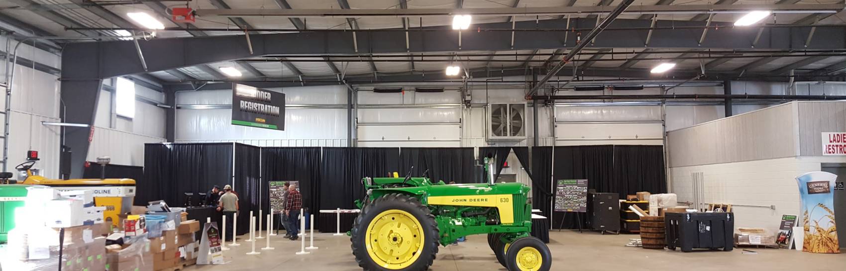 A trade show event showcasing a John Deere Tractor.