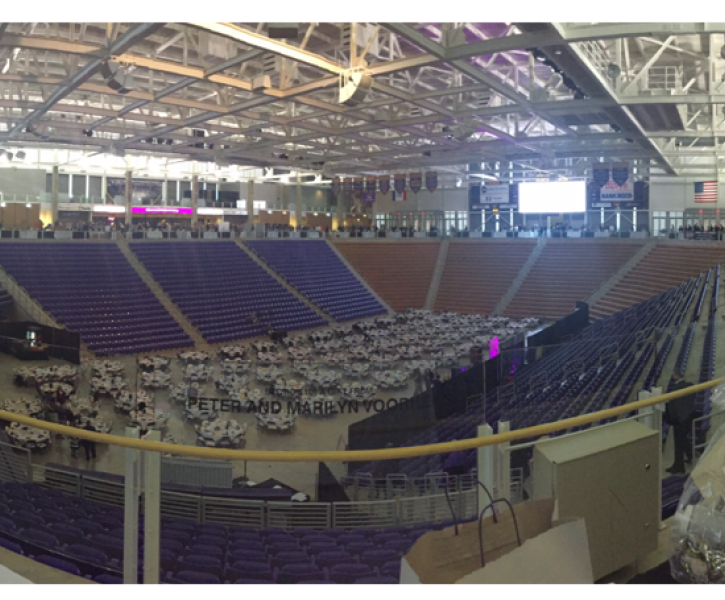 A event being held at a college with a large seating arrangement. 
